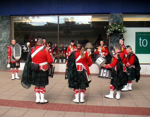 July 2002. Solihull - Queen's Visit - the Drum Corps warm up - names show when mouse placed on head